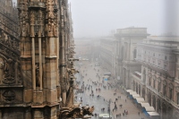 a rainy and foggy morning at the duomo in milan: view from the top of the duomo in milan on rainy morning