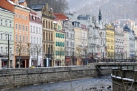 colorful buildings by the river at karlovy vary