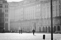 a lazy afternoon in the town square: scene from the town square with people strolling along