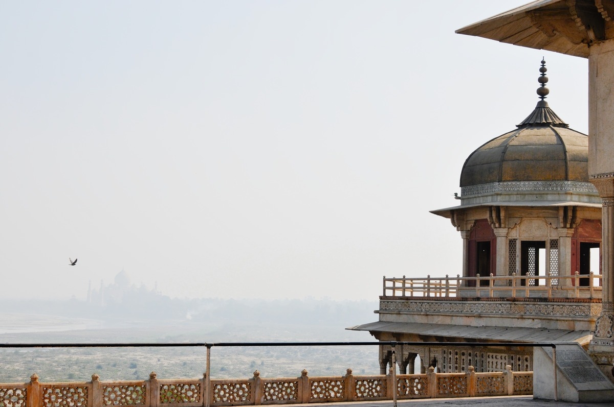 view of the taj mahal from the agra fort on a foggy (smoggy) morning