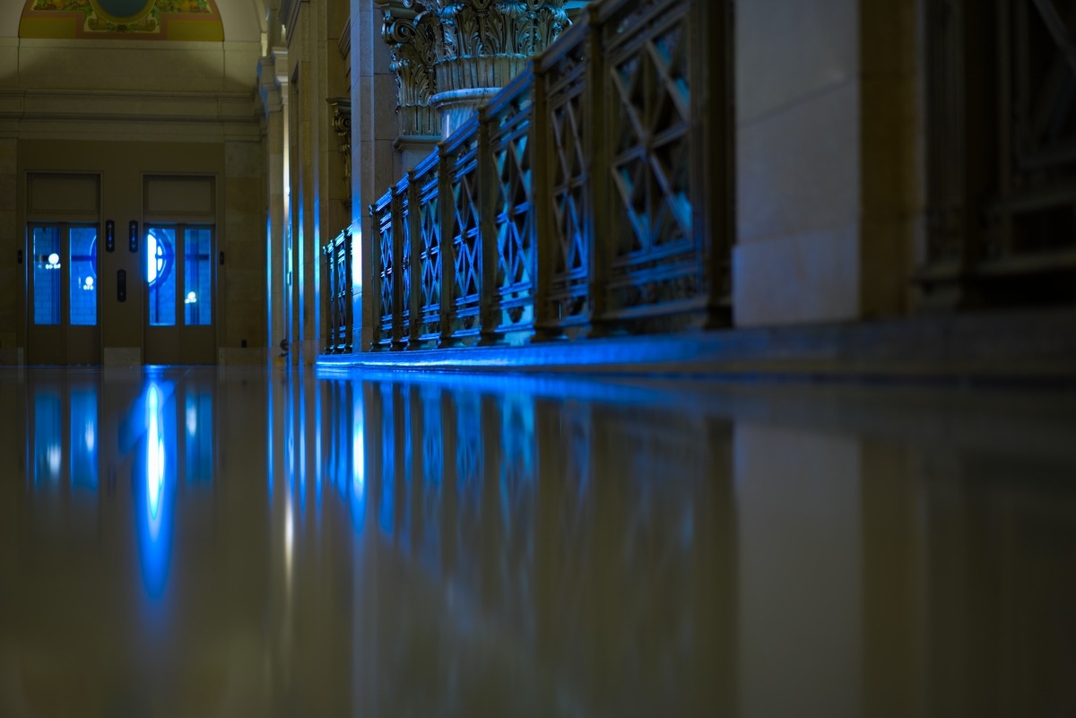 view down the corridor with blue lights
