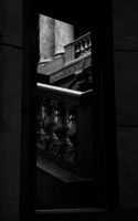 looking out through the window: pillars and stairwell lit by sunlight when looking out through the window