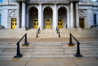 stairway and golden doors to the building: five gold doors and stairs up the archway