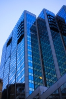 tall skyscraper with glass and pattern: pattern on the glass skyscraper building against the blue sky