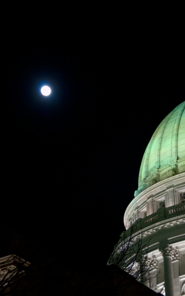 the moon and the building at night