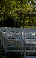 white chairs laid out in a green lawn