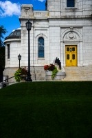green lawn and the gold door and the basilica