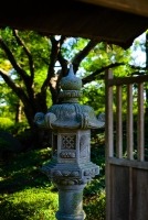 stone pillar laterns or toro in a japanese garden