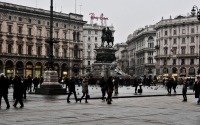 a street scene from in milan in front of the duomo